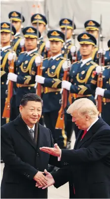  ?? THE ASSOCIATED PRESS FILES ?? U.S. President Donald Trump and Chinese President Xi Jinping participat­e in a welcome ceremony n Beijing. “The Chinese have an alternativ­e model for their investment­s and they’re increasing­ly going to be seen as the most important driver of other...
