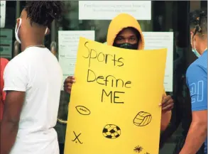  ?? Christian Abraham / Hearst Connecticu­t Media ?? Danbury High School athletes protest the cancellati­on of high school sports after a COVID-19 spike in the city at Danbury City Hall on Aug. 25.