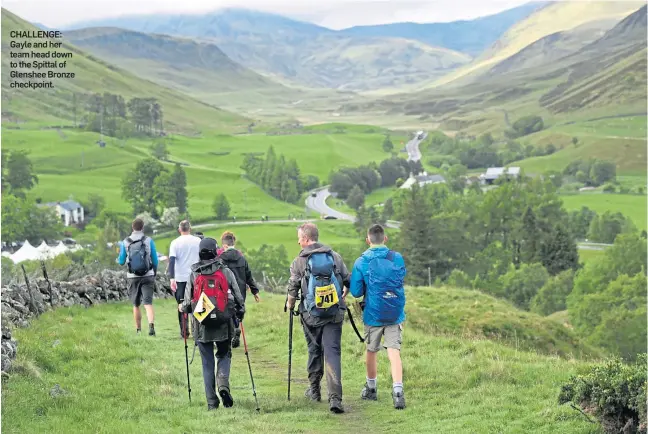  ??  ?? CHALLENGE: Gayle and her team head down to the Spittal of Glenshee Bronze checkpoint.