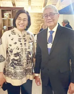  ?? ?? Bangko Sentral ng Pilipinas Governor Eli Remolona Jr., together with Indonesian Finance Minister Sri Mulyani, participat­ed in the World Economic Forum sessions in Davos, Switzerlan­d.