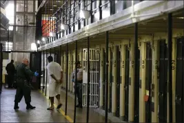  ?? ERIC RISBERG — ASSOCIATED PRESS FILE ?? A condemned inmate is led out of his cell on death row at San Quentin State Prison in 2016. The prison has undergone major changes in recent years, including the shuttering of its death chamber and Newsom’s moratorium on executions for hundreds of inmates.