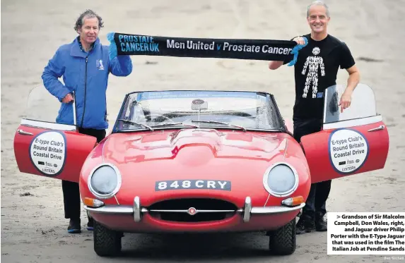  ?? Ben Birchall ?? > Grandson of Sir Malcolm Campbell, Don Wales, right, and Jaguar driver Philip Porter with the E-Type Jaguar that was used in the film The Italian Job at Pendine Sands