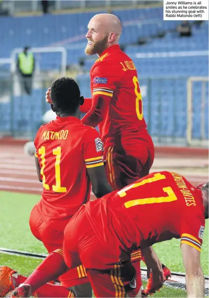  ??  ?? Jonny Williams is all smiles as he celebrates his stunning goal with Rabbi Matondo (left)