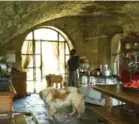  ??  ?? Aurora Baccheschi Berti, cookbook author and owner of Castello di Vicarello, prepares a meal in her expansive kitchen.