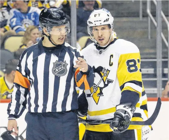  ?? CHARLES LECLAIRE • USA TODAY SPORTS ?? Referee Wes McCauley talks with Pittsburgh Penguins centre Sidney Crosby prior to a face-off during a game in April against the Boston Bruins at PPG Paints Arena.