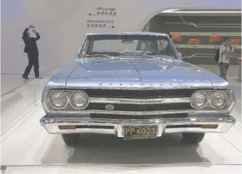  ?? KIN CHEUNG/AP ?? A 1965 Chevrolet Malibu at an auto show in China in 2013.