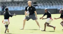  ?? Picture: JACKIE CLAUSEN ?? A SPORT: Prince Harry, who met many children on his visit to South Africa, took time out to play tag rugby at Durban’s Kings Park Stadium this week
