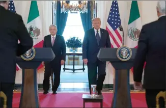  ?? AP PHOTO EVAN VUCCI ?? Mexican President Andres Manuel Lopez Obrador and President Donald Trump arrive to deliver a statement before a dinner at the White House, Wednesday in Washington.