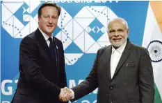  ??  ?? BRISBANE: In this file photo Britain’s Prime minister David Cameron (L) shakes hands with India’s Prime Minister Narendra Modi (right) during a bilateral meeting on the sidelines of the G20 Summit at the Brisbane Convention and Exhibition­s Centre...