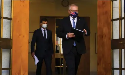  ??  ?? ‘At no point in his media release did Angus Taylor, pictured with Scott Morrison, mention the impact of the pandemic on cutting emissions.’
Photograph: Lukas Coch/AAP