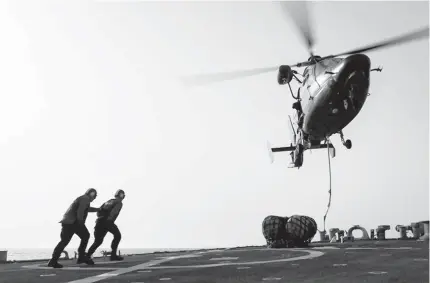  ?? US NAVY/COURTESY ?? The Norfolk-based destroyer USS Laboon receives supplies from the French carrier FS Charles de Gaulle on Monday in the Arabian Gulf.