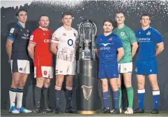  ?? AFP ?? Captains, from left, Scotland’s Jamie Ritchie, Wales’ Ken Owens, England’s Owen Farrell, France’s Antoine Dupont, Ireland’s Jonathan Sexton and Italy’s Michele Lamaro pose with the Six Nations trophy.