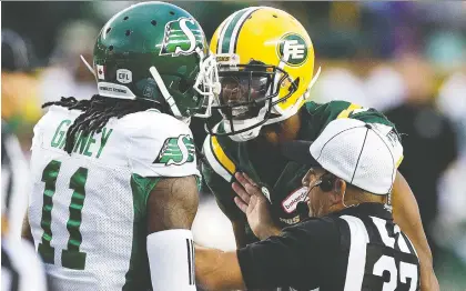  ?? DAVID BLOOM/FILES ?? Emotions were running high on Aug. 2 at Commonweal­th Stadium when Edmonton’s Kenny Stafford and Saskatchew­an’s Ed Gainey had a spirited discussion as an official intervened, But that sort of passion is nowhere to be found with the Riders in town this time, Terry Jones says.