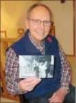  ?? NEWS PHOTO GILLIAN SLADE ?? Top right: Schofield’s son holds a photo taken on the day he (Laurie Schofield of Medicine Hat) was christened. In the photo he is held by his mother Olive with his father on the left.