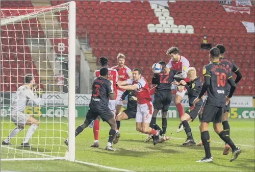  ?? PICTURE: BRUCE ROLLINSON ?? CLOSE CALL: A goalmouth scramble as Rotherham United’s Kieran Sadlier heads goalwards against Watford last night.