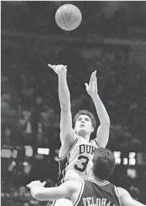  ?? AP FILE ?? Duke’s Christian Laettner shoots the game-winning basket in overtime over Kentucky’s Deron Feldhaus in the 1992 NCAA regional final.