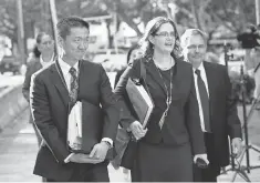  ?? BRUCE OMORI, EUROPEAN PRESSPHOTO AGENCY ?? Hawaii Attorney General Douglas Chin, left, arrives to challenge President Trump’s travel ban in a district court.