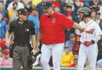  ?? STAFF PHOTOS BY MATT WEST ?? ANGER MANAGEMENT: Manager John Farrell tries to keep Dustin Pedroia away from umpire Mark Wegner before being ejected in the second inning.