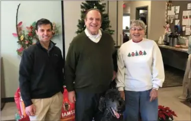  ?? SUBMITTED PHOTO ?? State Sen. Andy Dinniman, center, and Dr. Tom Garg of Hope Veterinary Specialist­s, left, deliver pet food to the Coatesvill­e Area Senior Center as part of the Henry’s Helping Paws Program. Also, pictured is Nancy Althouse of Caln who frequents the Coatesvill­e Area Senior Center.