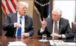  ?? AP/EVAN VUCCI ?? President Donald Trump talks with Democratic House Whip Steny Hoyer during an extended meeting on immigratio­n with lawmakers from both parties Tuesday in the White House Cabinet Room.