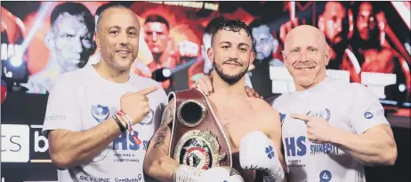  ?? ?? BACKING HIS MAN Trainer Michael Ballingall, left, is certain Micahel McKinson, centre, will defeat Vertil Ortiz Jr