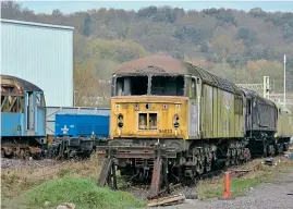  ?? BRAD JOYCE ?? Locos stored at Progress Rail's Longport site include Class 56 Nos. 56032 and 56065 along with Class No. 66048 which was written off in the Carrbridge accident on January 4, 2010. 56065 is a Class 69 conversion candidate.