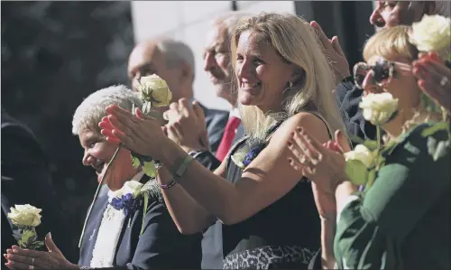  ??  ?? Kim Leadbeater, centre, the sister of Jo Cox, applauds with her parents Jean, left, and Gordon top right, and Jeremy Corbyn, centre left.