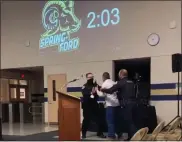  ?? IMAGE FROM SCREENSHOT ?? Two Spring-Ford School district Police Officers remove Limerick resident James Troutman from Monday night’s school board meeting.