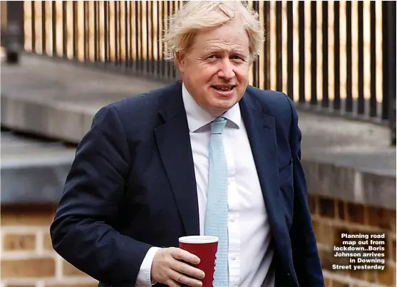  ?? Pictures: ANDREW PARSONS / NO 10, REUTERS ?? Planning road map out from lockdown..Boris Johnson arrives in Downing Street yesterday