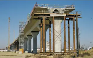  ?? ASSOCIATED PRESSS FILE PHOTO ?? One of the elevated sections of the high-speed rail is under constructi­on in Fresno, Calif., in 2017. The Trump administra­tion canceled nearly $1 billion in federal money for California’s high-speed rail project last week, further throwing into question the future of the ambitious plan to connect Los Angeles and San Francisco.