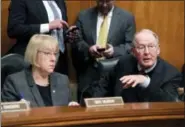  ?? THE ASSOCIATED PRESS ?? Senate Health, Education, Labor, and Pensions Committee Chairman Sen. Lamar Alexander, R-Tenn., accompanie­d by the committee’s ranking member Sen. Patty Murray, D-Wash., speaks on Capitol Hill in Washington. Millions of people who buy individual health...