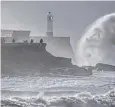  ?? ?? High tides and strong winds combine to dramatic effect at Porthcawl, Wales