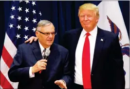  ?? ASSOCIATED PRESS ?? IN THIS JAN. 26, 2016, FILE PHOTO, Republican presidenti­al candidate Donald Trump is joined by Joe Arpaio, the sheriff of metro Phoenix, at a campaign event in Marshallto­wn, Iowa.