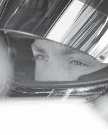  ?? JARED C. TILTON/GETTY ?? Denny Hamlin sits in his car during qualifying for the Toyota Owners 400 on Satuday.