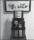  ?? Photo courtesy of University of Connicticu­t ?? Connecticu­t football Coach Bob Diaco wanted to spark a rivalry, and even constructe­d a trophy. Problem is, no one told Central Florida, who forgot the trophy after Saturday’s game.