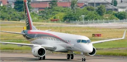  ?? Bloomberg ?? The Mitsubishi Regional Jet, also known as the MRJ was launched by ANA Holdings, operator of Japan’s biggest airline. —