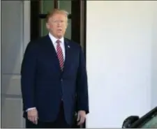  ?? MANUEL BALCE CENETA — THE ASSOCIATED PRESS ?? President Donald Trump waits at the main entrance to the West Wing for the arrival of the Emir of Qatar Sheikh Tamim bin Hamad al-Thani, at the White House in Washington, Tuesday.