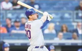  ?? Mike Stobe / Getty Images ?? Pete Alonso of the Mets hits a three-run home run in the first inning against the Yankees at Yankee Stadium on Tuesday night in New York.