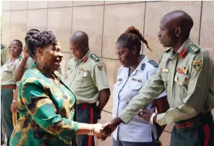  ?? ?? Women Affairs, Community, Small and Medium Enterprise­s Developmen­t Minister Monica Mutsvangwa is welcomed by members of the Zimbabwe National Defence University (ZNDU) directing staff ahead of her presentati­on on “The Participat­ion of Women and Youths in Economic Developmen­t: A case of Zimbabwe” yesterday