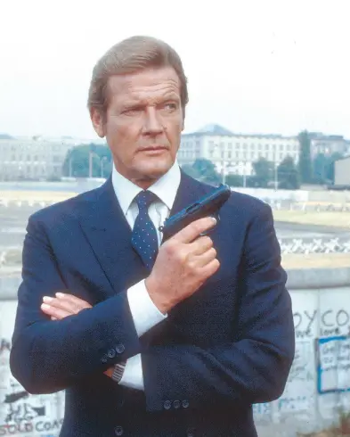  ?? WENN.COM ?? Roger Moore as James Bond in 1983’s Octopussy. Moore was best-known for his portrayal of Bond in six movies, and for his role as Simon Templar in television’s The Saint. The family announced his death, from cancer, at age 89.