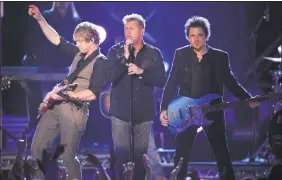  ??  ?? Rascal Flatts, from left, Joe Don Rooney, Gary Levox and Jay DeMarcus