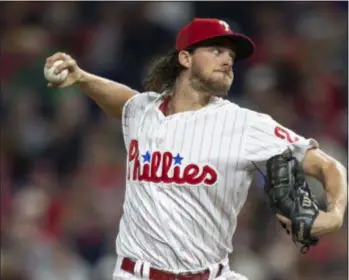  ?? LAURENCE KESTERSON – THE ASSOCIATED PRESS ?? Phillies starter Aaron Nola, here uncorking a first-inning pitch, pitched like the ace he is Saturday night against the Braves.