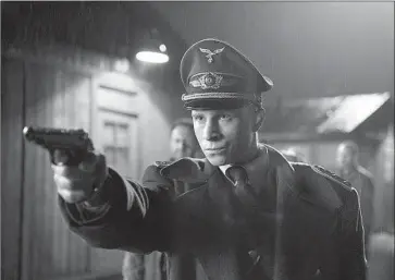  ?? Julia M. Muller Music Box Films ?? “THE CAPTAIN,” starring Max Hubacher as a young Nazi impostor, is shot in foreboding black and white.