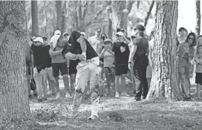  ?? ?? Xander Schauffele blasts from the pine straw on the seventh hole during The Players Championsh­ip on Thursday.