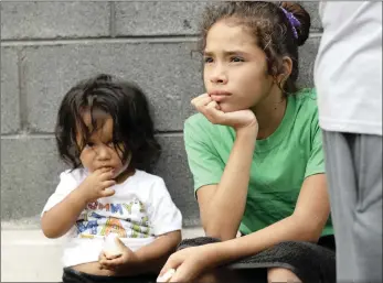  ?? Picture: AP/AFRICAN NEWS AGENCY (ANA) ?? Angui Funes, right, sits with her brother Jesus after crossing the border back to Reynosa, Mexico on Thursday. Their family, who were seeking asylum in the US, said they were told by officials they would be separated so they returned to Mexico.