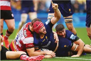  ?? ?? Battling on: Kyle Hatherell celebrates scoring Worcester’s opening try