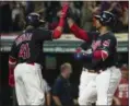  ?? PHIL LONG — THE ASSOCIATED PRESS ?? The Indians’ Edwin Encarnacio­n, right, is greeted by Carlos Santana after hitting a two-run home run off White Sox pitcher Miguel Gonzalez.