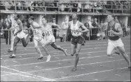  ?? / AP ?? Lindy Remigino (981) won the 100-meter final in the Olympic games at Helsinki, Finland, on July 21, 1952, in the closest finish of the event in years.