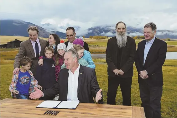  ?? AP PHOTO ?? APPROPRIAT­E USE: Interior Secretary Ryan Zinke speaks before signing a 20-year ban on new mining contracts in the mountains north of Yellowston­e National Park.