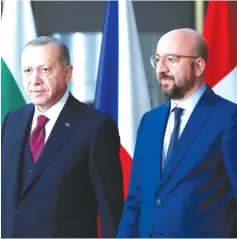  ?? ( Francois Lenoir/ Reuters) ?? TURKISH PRESIDENT Recep Tayyip Erdogan ( left) and EU Council President Charles Michel. It is true the major European countries don’t remain silent about Turkey, but their reactions are still below the level of Turkish danger and threat.